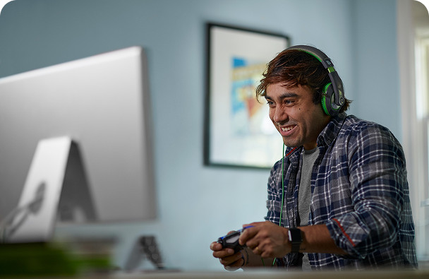 A young man playing game with internet services provided by Brightspeed.