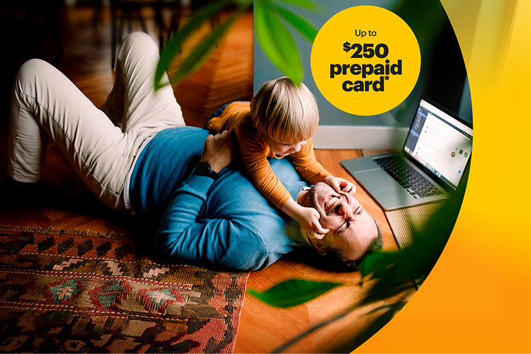 Family relaxing together at home, with a child sitting on a parent’s lap and a laptop nearby, connected with Brightspeed Internet.