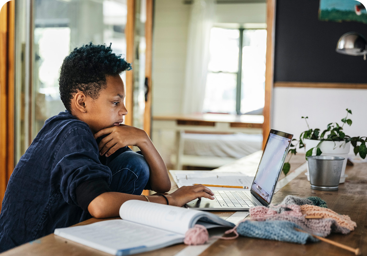 Child using a laptop at home with Brightspeed high-speed internet, representing reliable connectivity for learning, streaming, and everyday online activities.