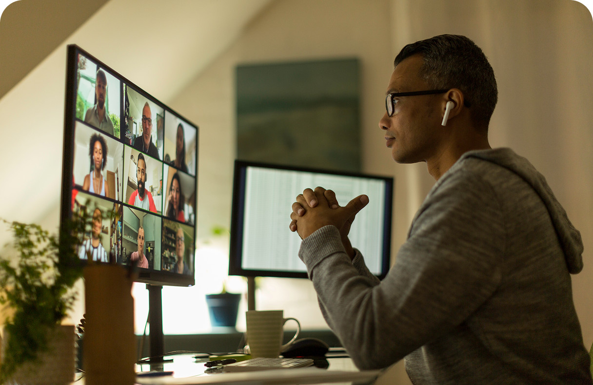 Person joining a video call on a desktop computer, connected through Brightspeed internet while working from home.