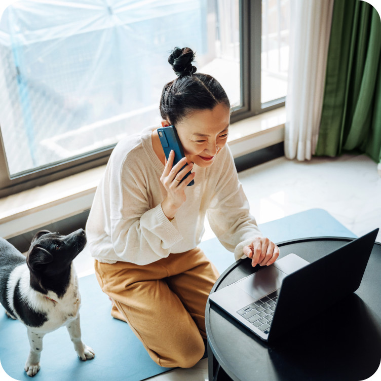 Woman using multiple devices at home with Brightspeed Whole Home WiFi for reliable wall-to-wall connectivity.